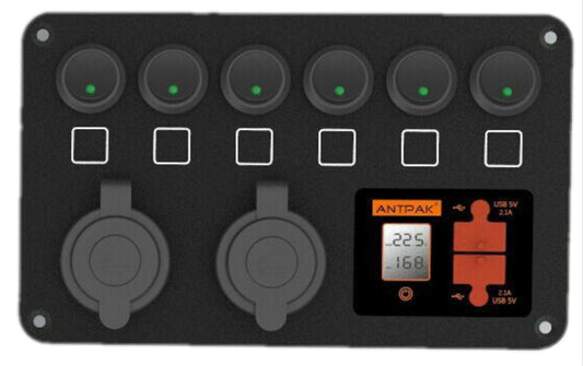A 12V DC power panel featuring 6 switches, dual battery voltmeter, 2 USB ports, and 2 cigar sockets, designed for surface mounting in vehicles such as 4WDs, marine, and caravans.