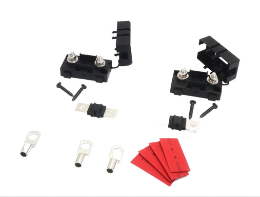 A set of 60A MIDI fuses and holders with accompanying cable lugs and mounting hardware, primarily in black and red colors.