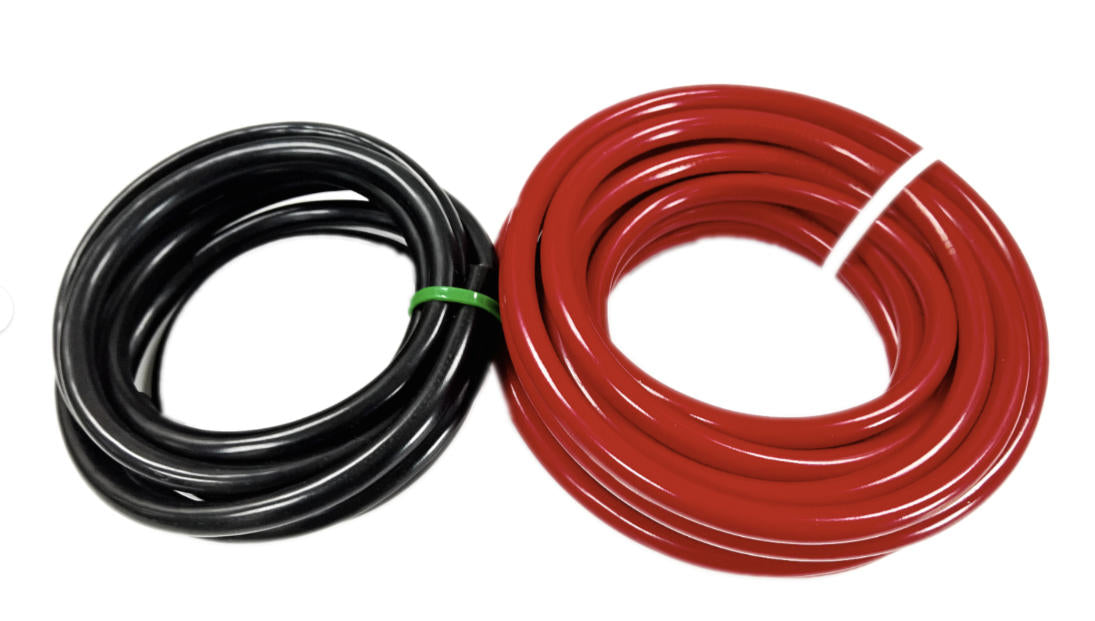Coiled black and red tubing can be Redarc REDARCBCDC1240D battery chargers