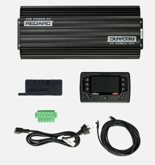 Redarc power management system with display, cables, and connectors on a white background